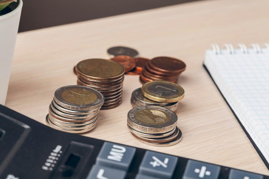 The close-up of accounting documents with money coins